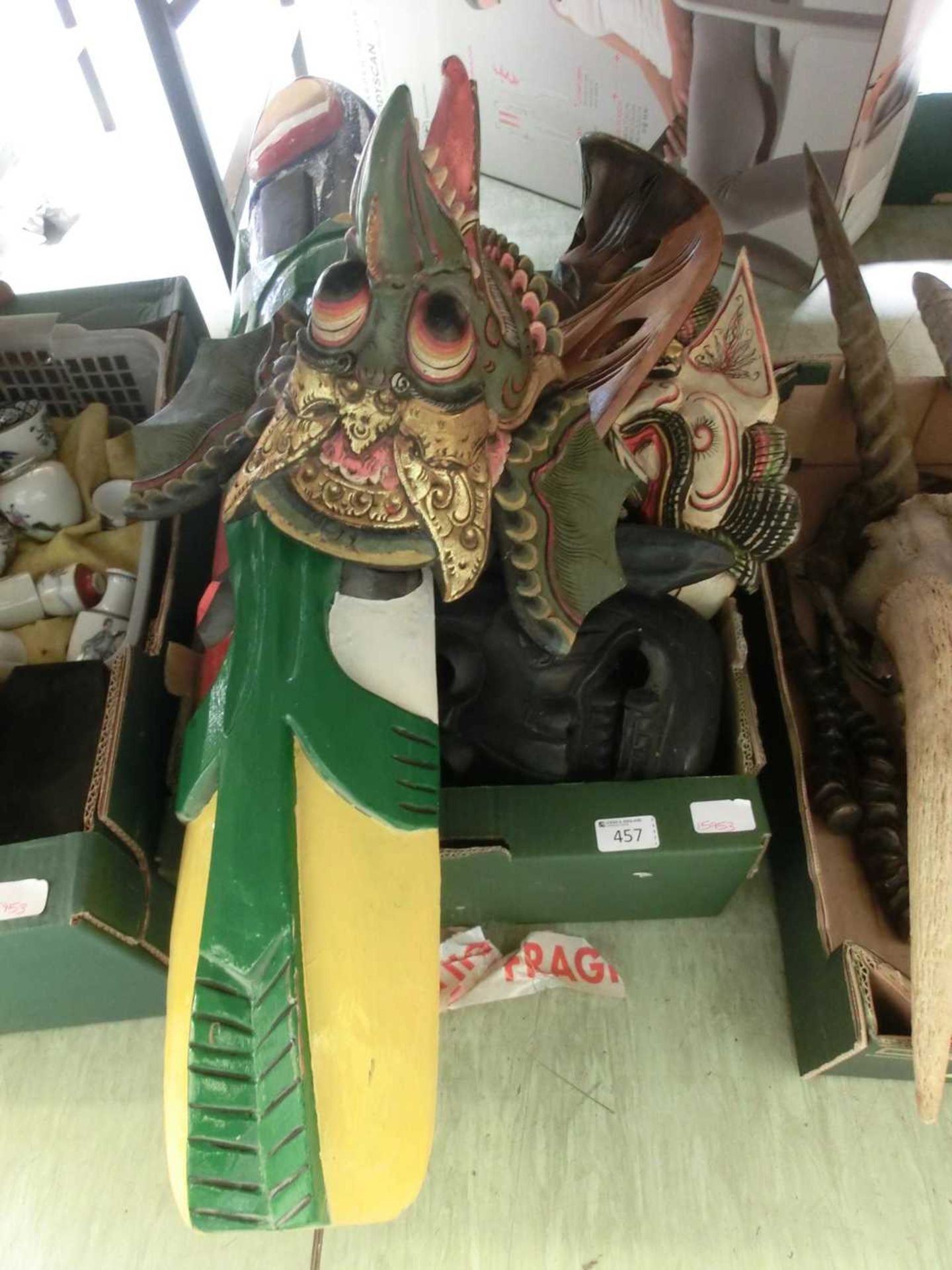 Tray containing wooden carved masks