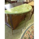 A gilt metal based demi-lune table with an similated green onyx top