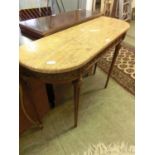 A reproduction continental style console table with a pink marble top