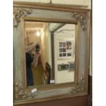 A reproduction gilt framed wall mirror