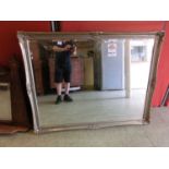 A large ornate gilt framed wall mirror