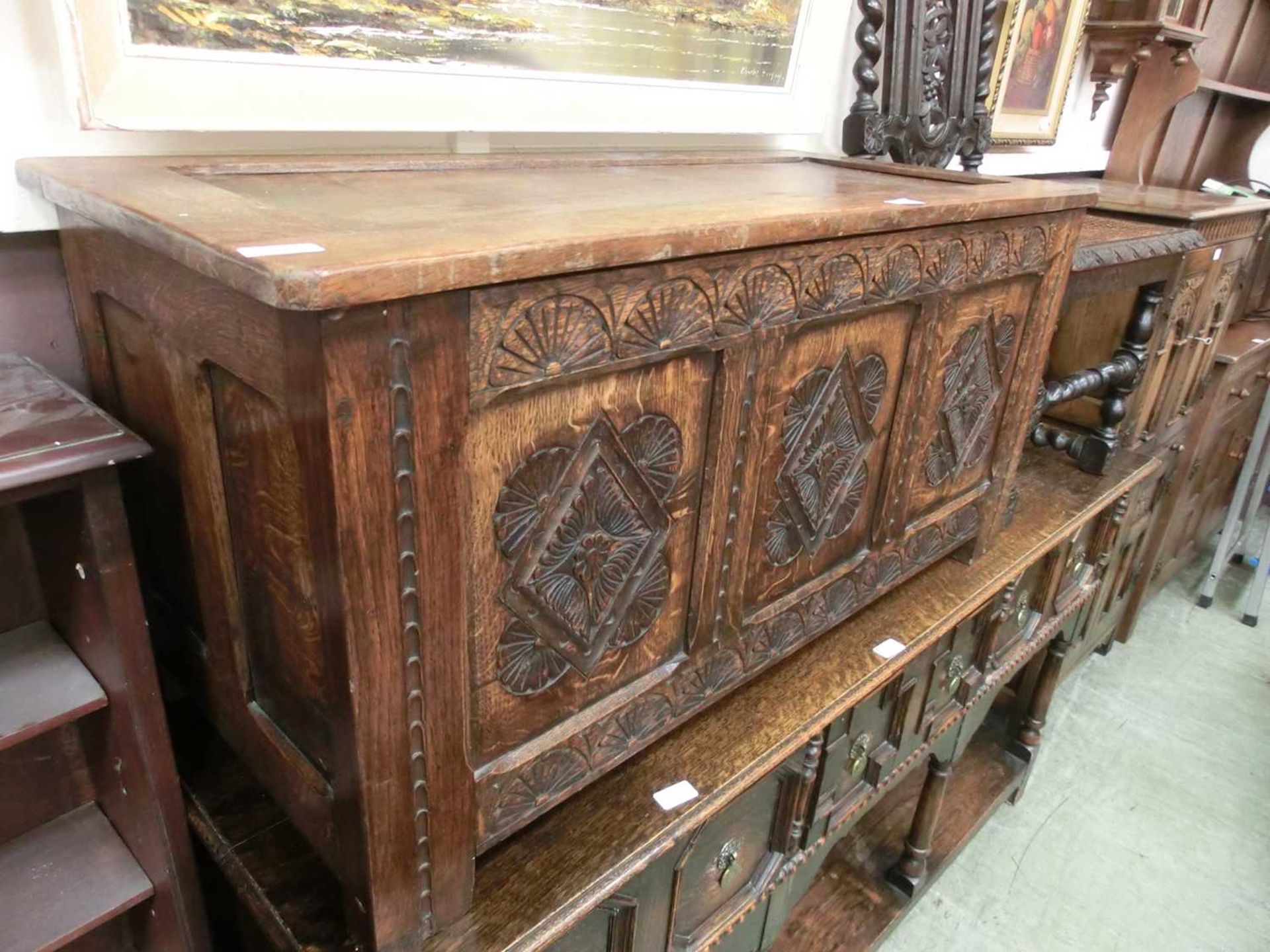 An early 20th century carved oak panel coffer