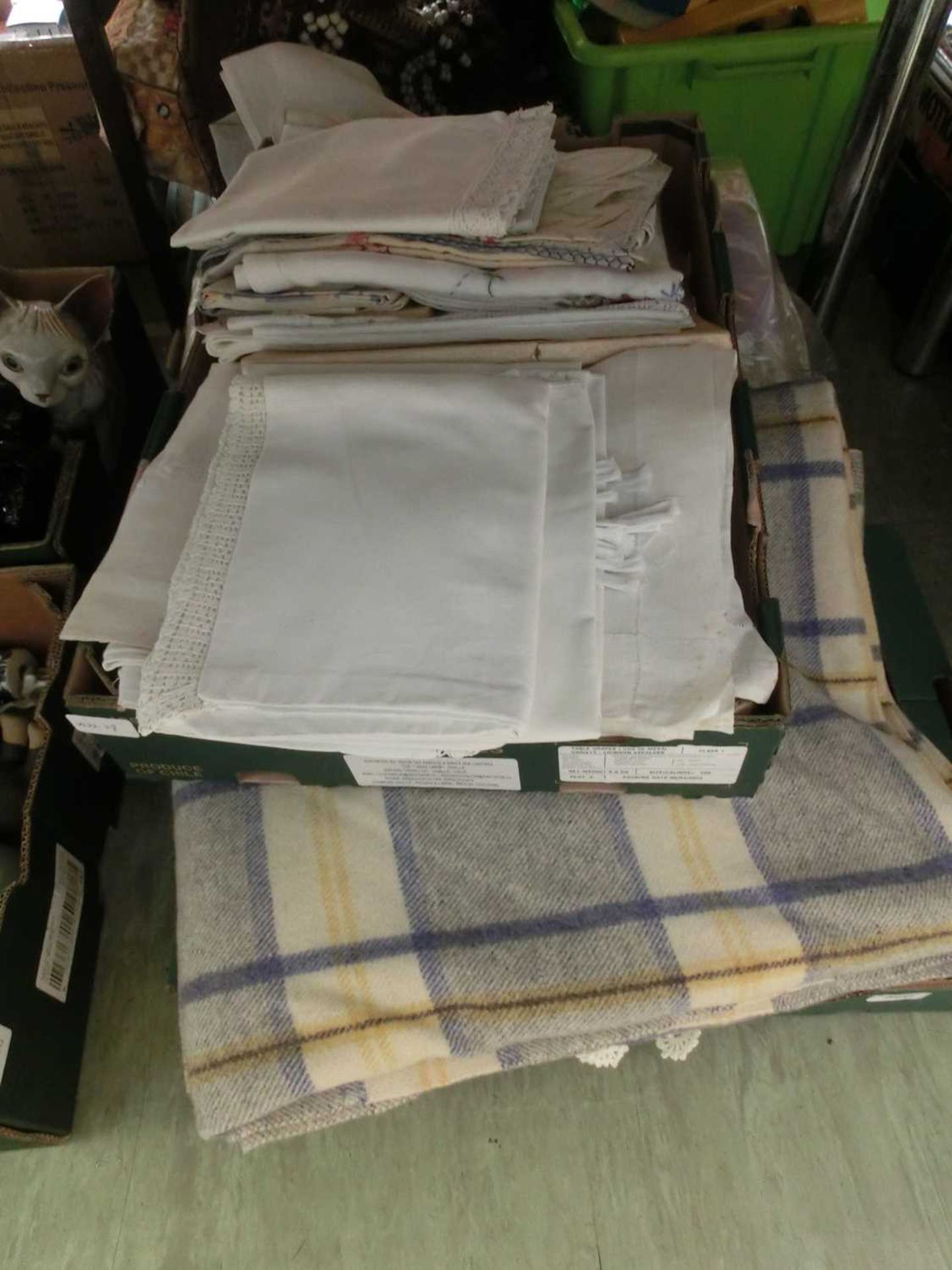 3 trays containing blankets, linen, etc.