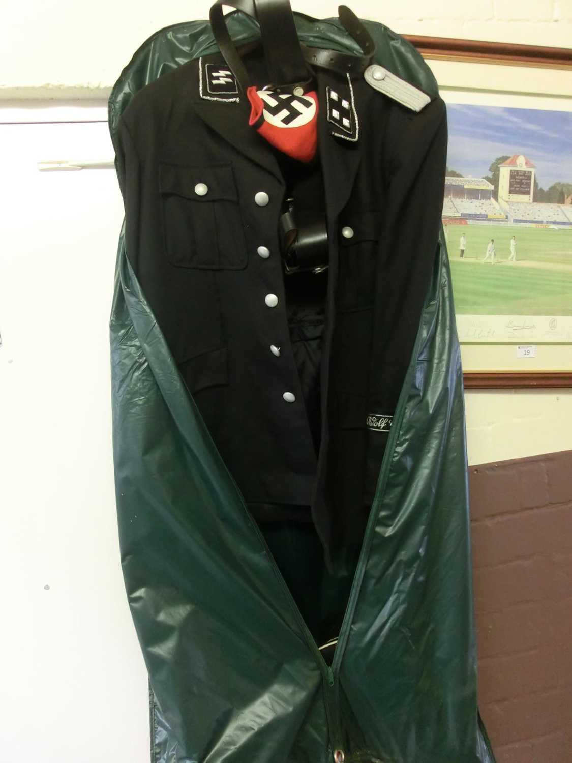 A black military jacket with leather belt