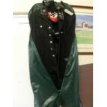 A black military jacket with leather belt