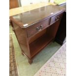 A reproduction walnut side cabinet having two drawers above open storage