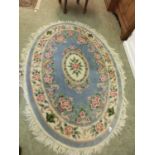 An oval blue ground Chinese rug