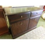 A Stag Minstrel cabinet having two drawers above two cupboard doors