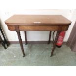 A Victorian mahogany folding tea table