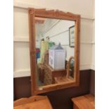 A carved pine framed hall mirror