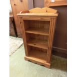 A modern pine low level bookcase