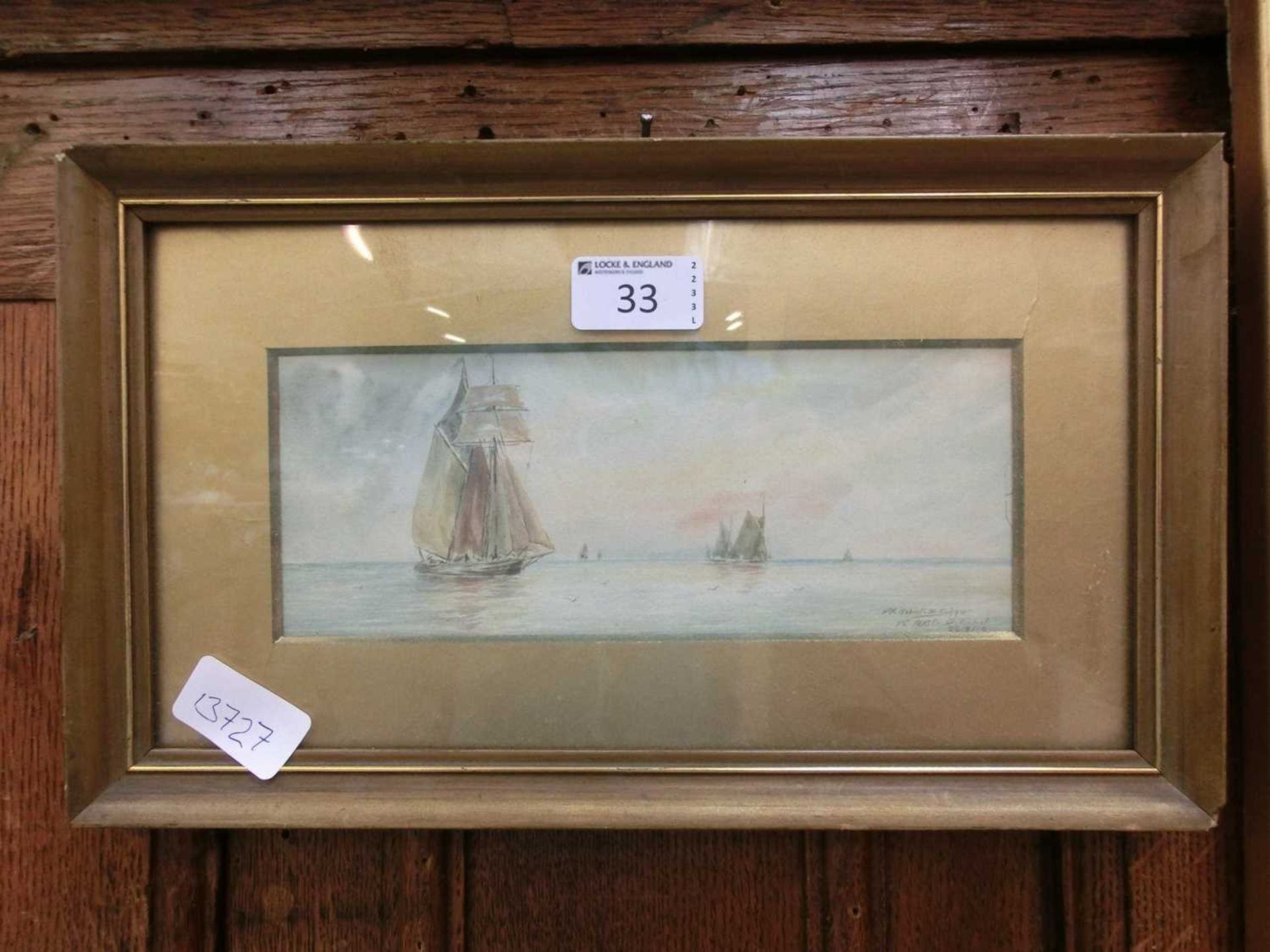 A framed and glazed watercolour of sailing vessels signed Robert Shaw