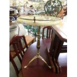 A gilt metal and green onyx style pedestal table