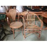 An early 20th century bergere seated bedroom chair together with a bamboo chair
