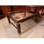 A modern gilt metal, eastern hardwood rectangular occasional table with smoked glass top