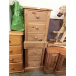 A pair of modern pine three drawer bedside chests