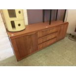 A mid-20th century teak sideboard base (Lacking top)