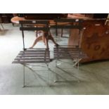 A pair of metalwork framed folding garden chairs