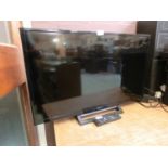 A Sony flat screen TV with remote