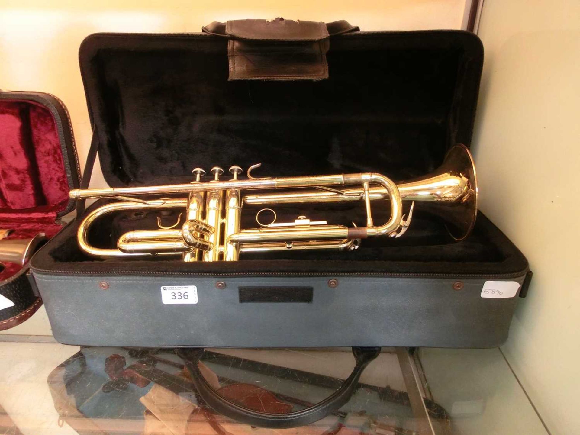 A brass trumpet in soft case