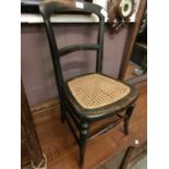 A late 19th century ebonized child's chair