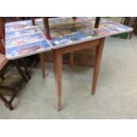 A mid-20th century Formica topped drop leaf kitchen table