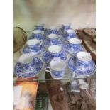 A set of Noritake blue and white coffee cups and saucers