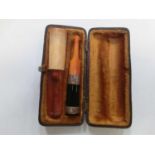 Two cased cheroot holders