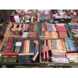 Four trays of assorted hardback books to include the Iliad, works of Shakespeare, etc
