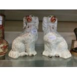 A pair of Staffordshire fireside spaniels