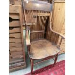 A Victorian oak and elm seat open arm stick back chair (A/F)