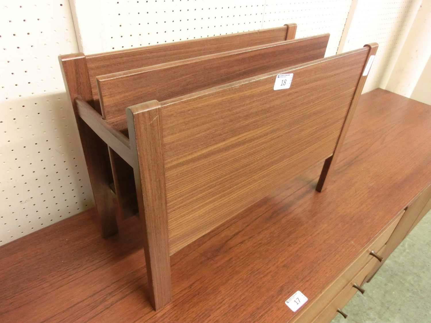 A mid-20th century teak magazine rack