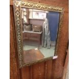 An early 20th century brass framed mirror