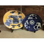 A blue and white oriental plate together with an oval oriental style plate with fashion decoration