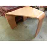 A modern beech and ply bentwood coffee table possibly by Stressless