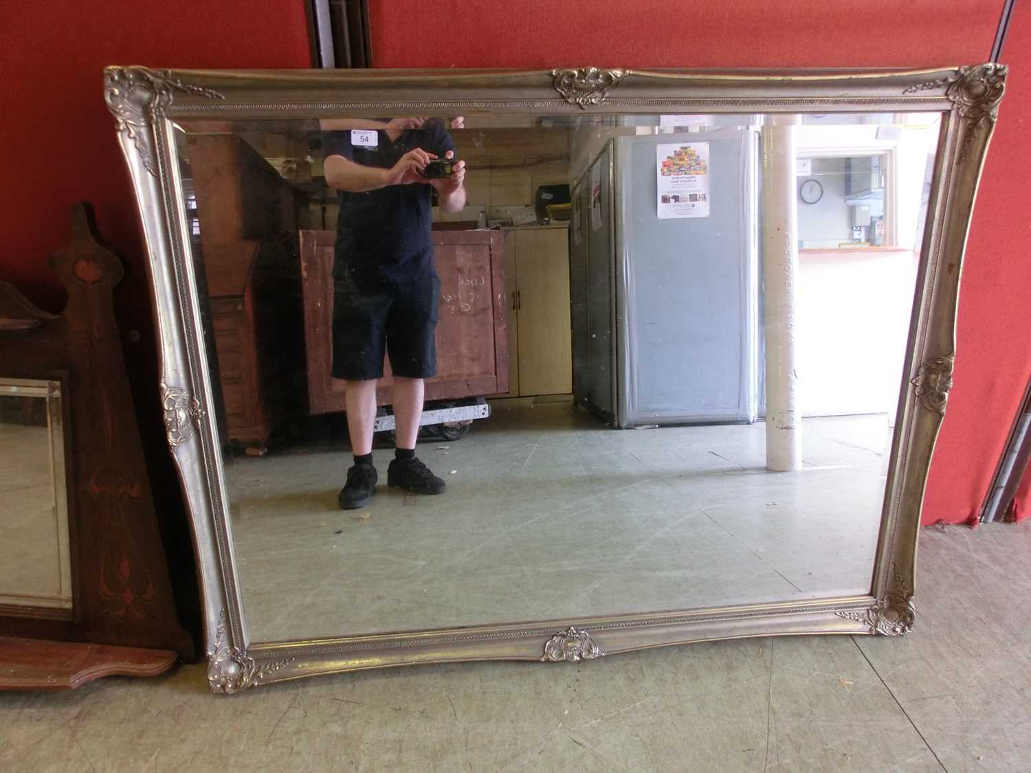 A large ornate gilt framed wall mirror