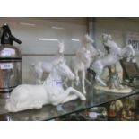 Four Royal Doulton white ceramic models of horses along with one other