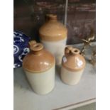 Three stoneware storage vessels, two bearing maker's namesNamed jug measures 42cm in height. Photo