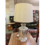 A silvered glass base table lamp with shade