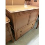 A reproduction oak coffer with two drawers under