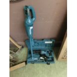 A Makita JR3050T 110V reciprocating saw in case together with a Makita CL183D cordless vacuum