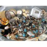 An assortment of costume jewellery to include mainly brooches