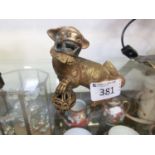 A gilt metal model of a foo dog with ball