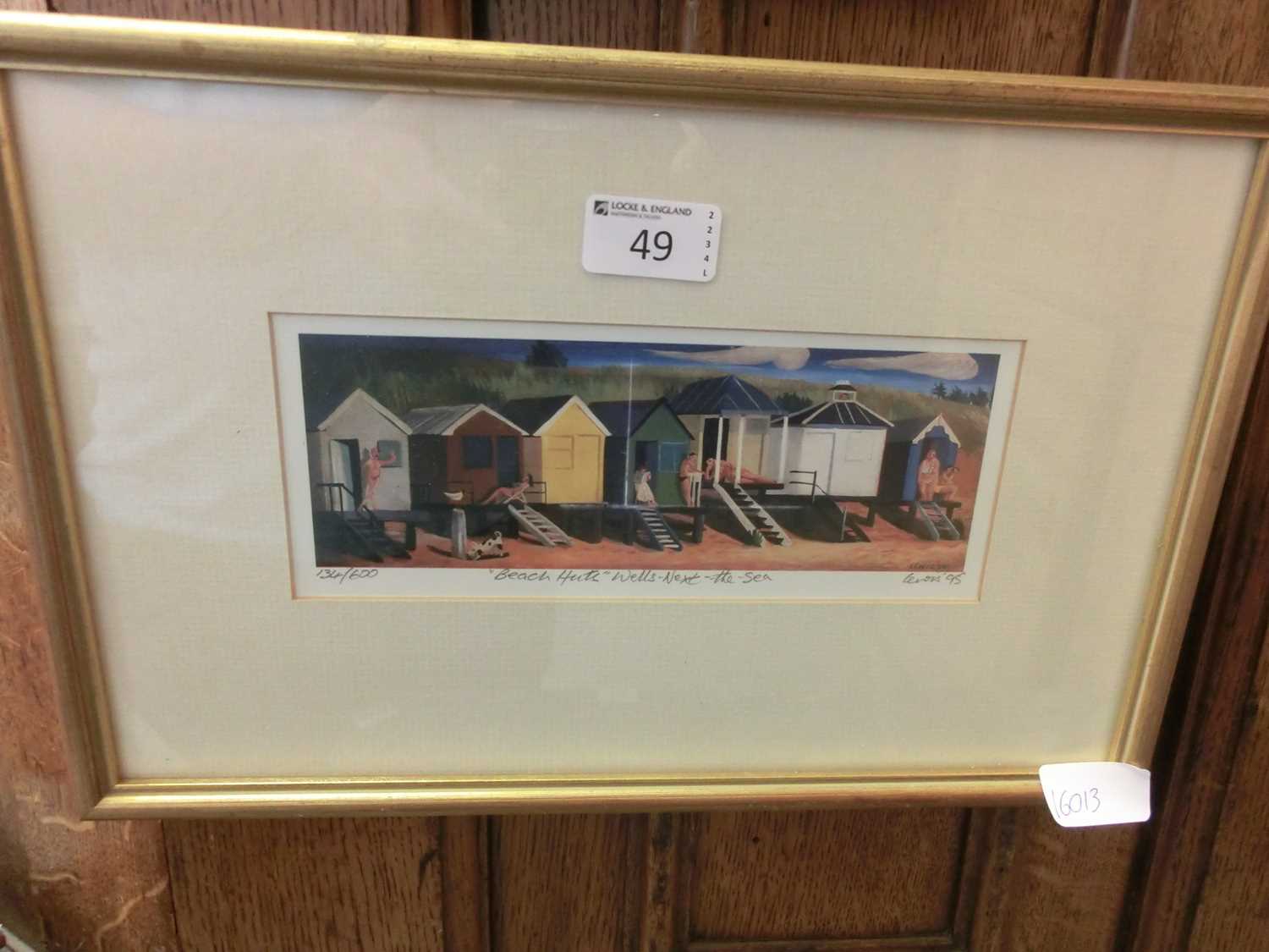 A limited edition print 'Beach Huts - Wells-Next-The-Sea' signed Lewis '95