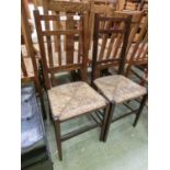 A pair of Edwardian rush seat bedroom chairs