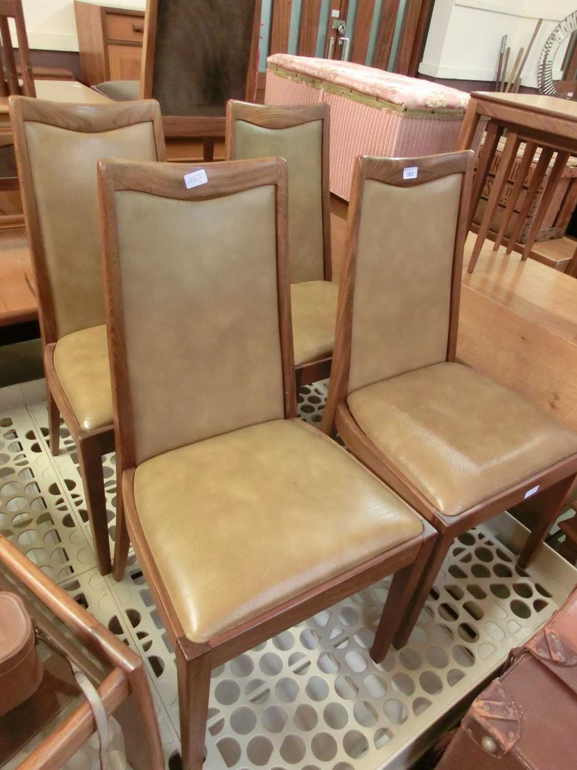 A set of four mahogany and Rexine seat mid-20th century dining chairs