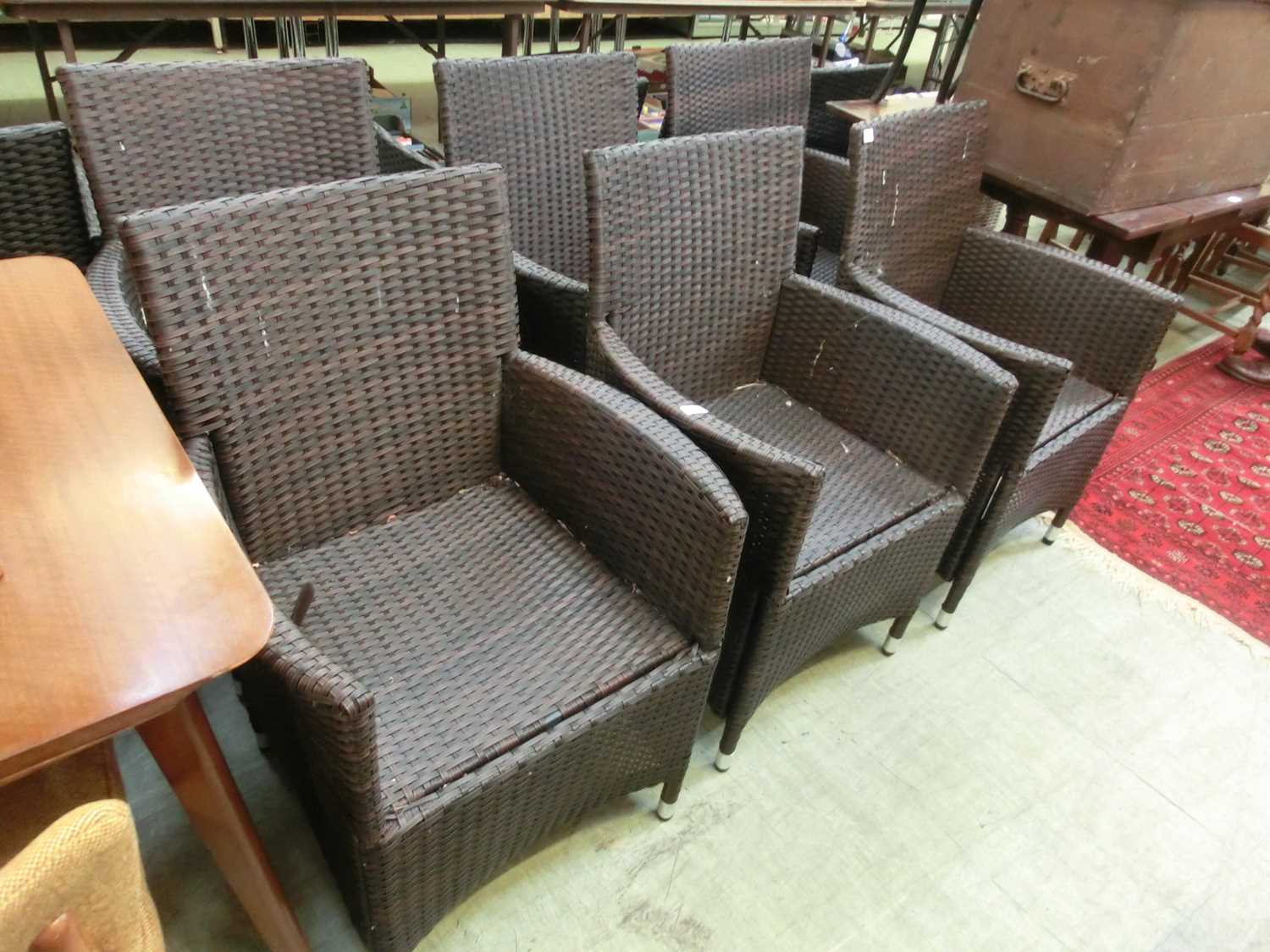 A set of six rattan effect conservatory chairs