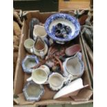 A tray containing an assortment of items to include cloisonné napkin rings, ceramic jugs,