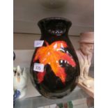 A Poole Pottery baluster vase with leaf design