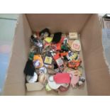 A box containing an assortment of keyrings